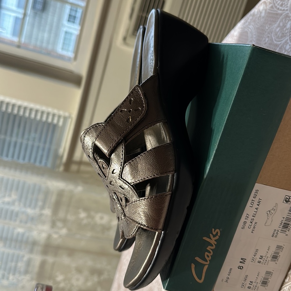 Gorgeous new Clark sandals we but never worn outside, comfy too late to return